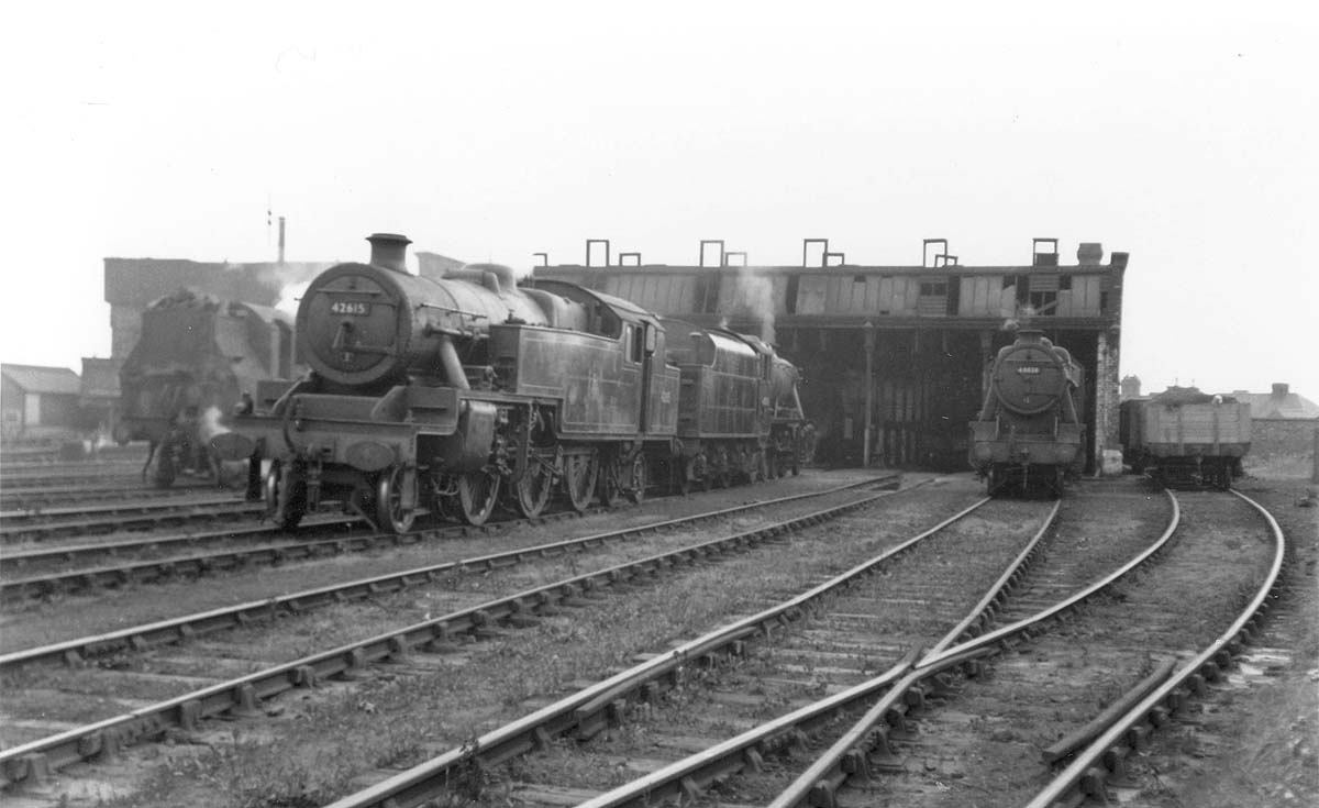 A number of ex-LMS standard locomotives are seen in steam standing on the shed's roads circa 1955