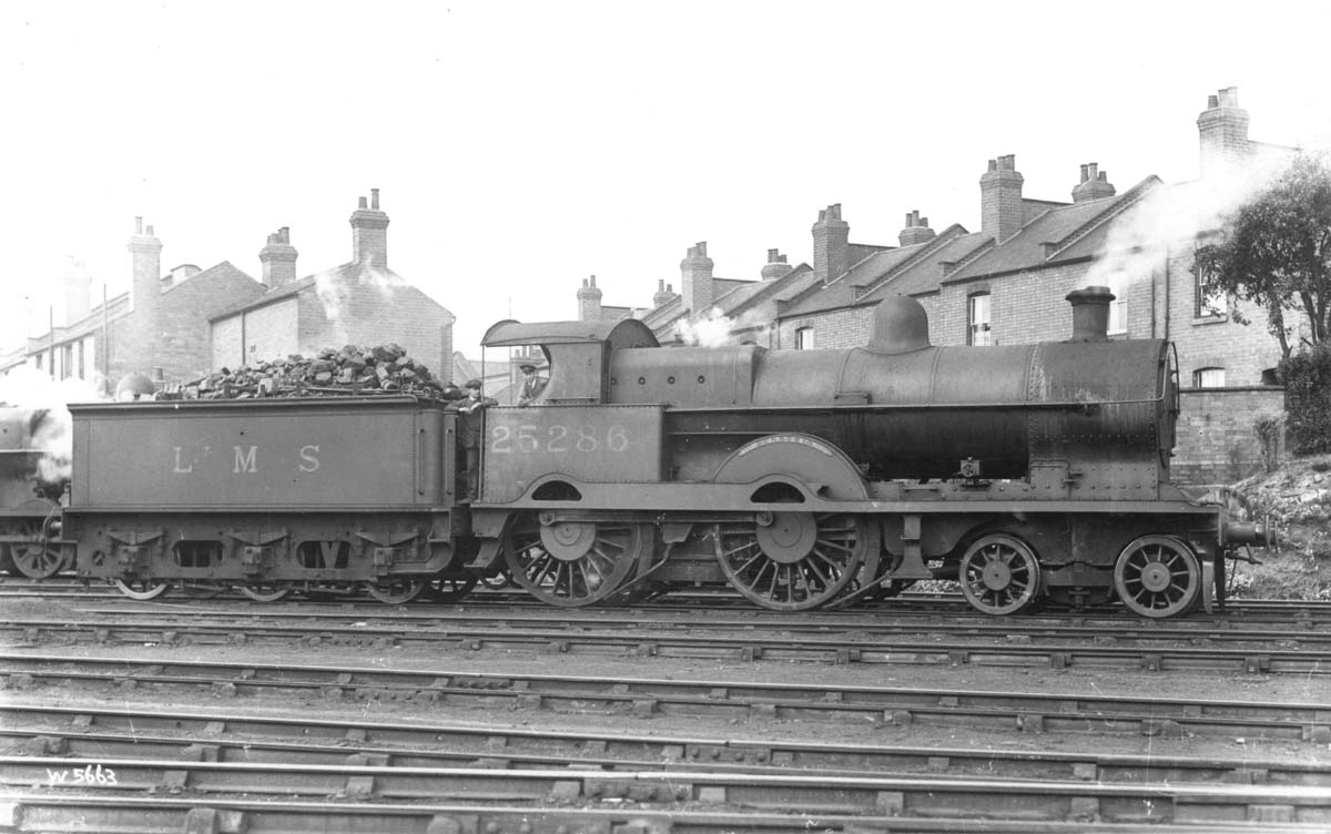 Ex-LNWR 4-4-0 No 25286 'Dunrobin' is seen with crew and in steam outside Warwick shed in the early 1930s