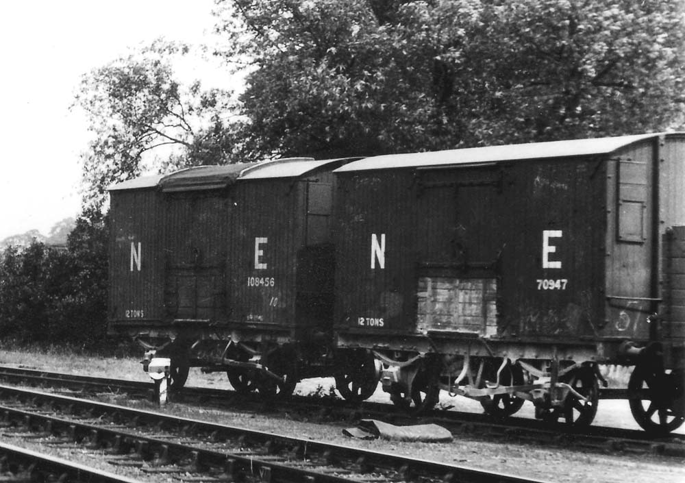 Close up of the two 10ft wheelbase, unfitted, 12 ton ex-NE vans standing in Alcester's goods yard