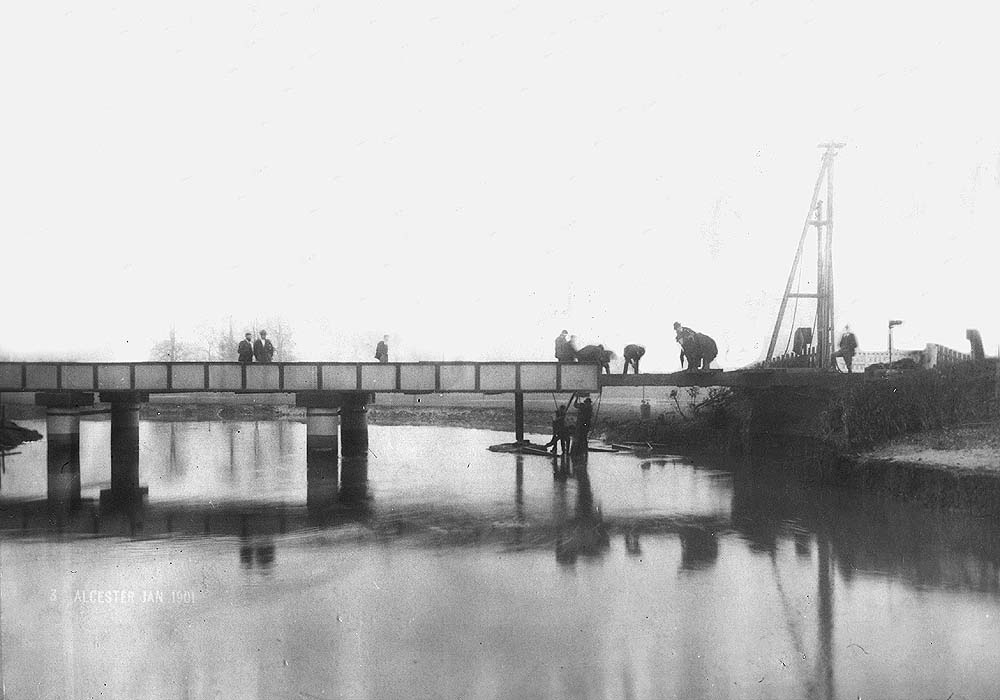 Workman are rebuilding the final span on this girder bridge damaged by the storms and flood water of the winter of 1900/1901