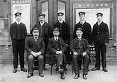 A posed photograph of Alcester station staff  with both the Great Western Railway and Midland Railway station masters present circa 1910