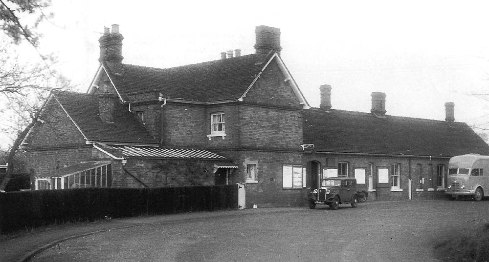 External view showing the station approach and station building with the station master's house situated on the left