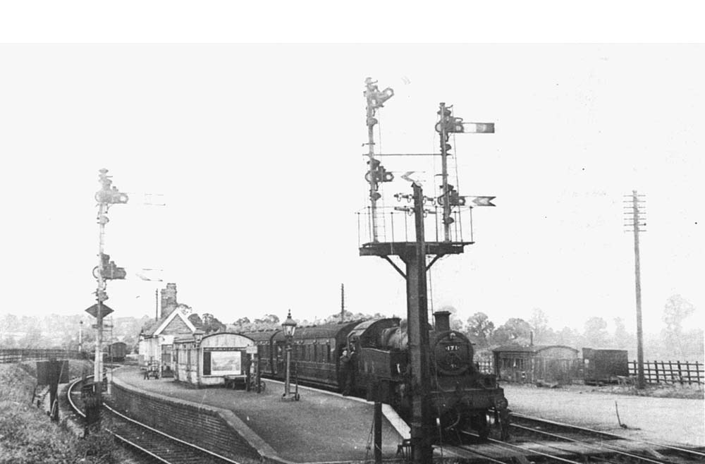 Ex-LMS 3MT 2-6-2T No 171 stands at Broom Junction station with a Birmingham to Ashchurch local service