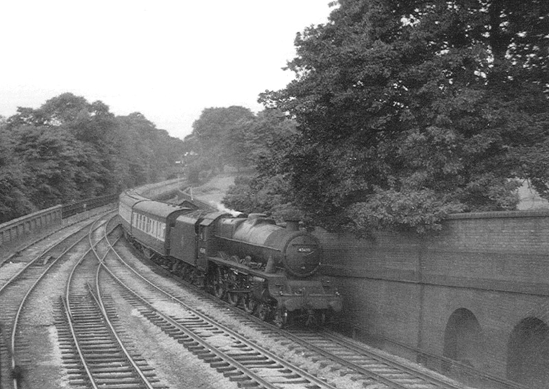 Ex-LMS 4-6-0 5XP No 45690 'Leander' is working an up express service from the South West to New Street station circa 1953