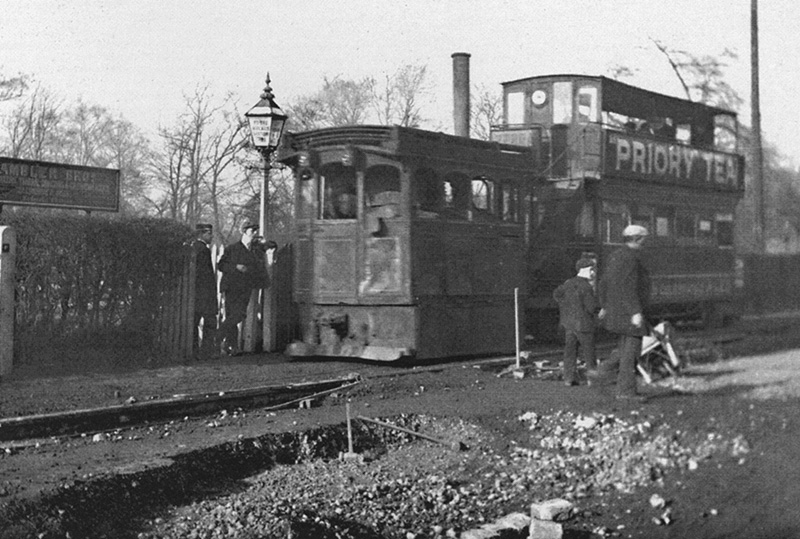 View of one of the last steam trams passing Kings Heath station shortly before they were retired in 1906