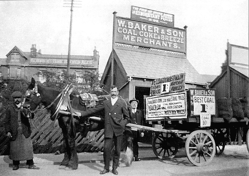 A publicity photograph of W Baker & Sons coal delivery cart and staff in front of their offices in station drive