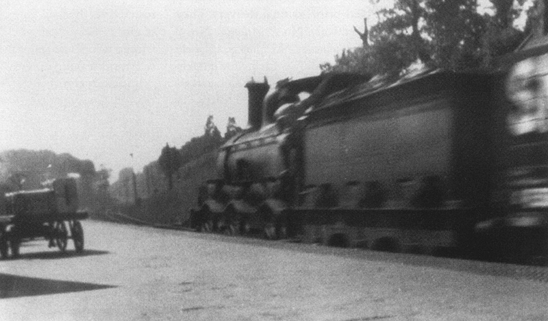 An unidentified Midland Railway 0-6-0 Class 700 is seen passing through Kings Heath station on a down goods train in 1928