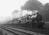 A pair of ex-MR class 2P 4-4-0s No 505 and No 368 are seen running at speed at the head of an express train
