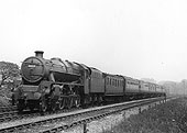 LMS 4-6-0 5MT No 5013 is seen at the head of a short express service near Kings Norton in 1937