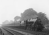 LMS Stanier 5P5F No 5280 is seen sporting train reporting number 230 as it hurries past with a long express train