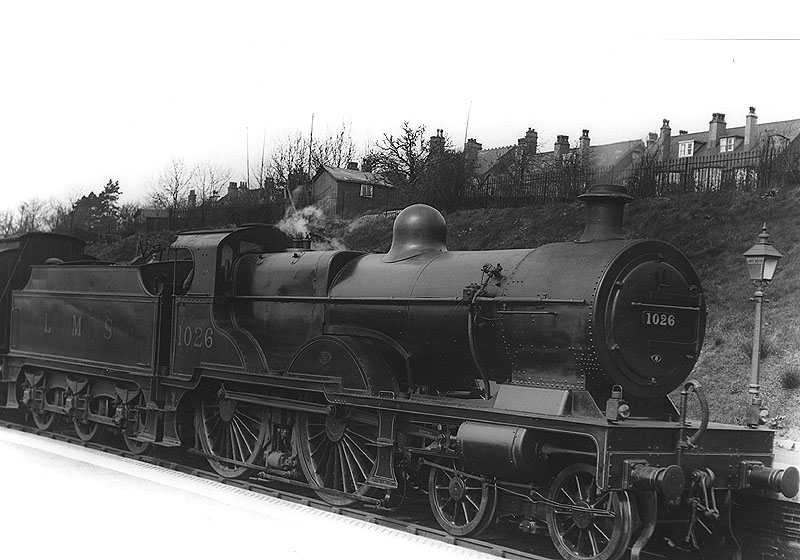 LMS 4-4-0 "Compound" stands at the station with a local passenger train