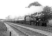 LMS 4-4-0 'Compound' 4P No 1027 works very hard whilst on a twelve coach express train in the summer of 1936