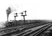 LMS 4-4-0 'Compound' 4P No 1077 is seen working hard as it heads an up empty stock working out of the sidings