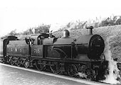 LMS 3P 4-4-0 No 718 stands at the West Suburban Railway up platform at the head of a local train in November 1931