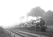 A pair of ex-MR class 2P 4-4-0s No 505 and No 368 are seen running at speed at the head of an express train
