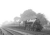 LMS Stanier 5P5F No 5280 is seen sporting train reporting number 230 as it hurries past with a long express train