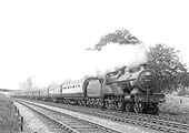 LMS 4-4-0 'Compound' 4P No 1027 is working very hard whilst on a twelve coach express train in the summer of 1936