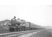 LMS 4-4-0 'Compound' 4P No 1030 is seen at the head of a holiday special express passenger working during the summer of 1937