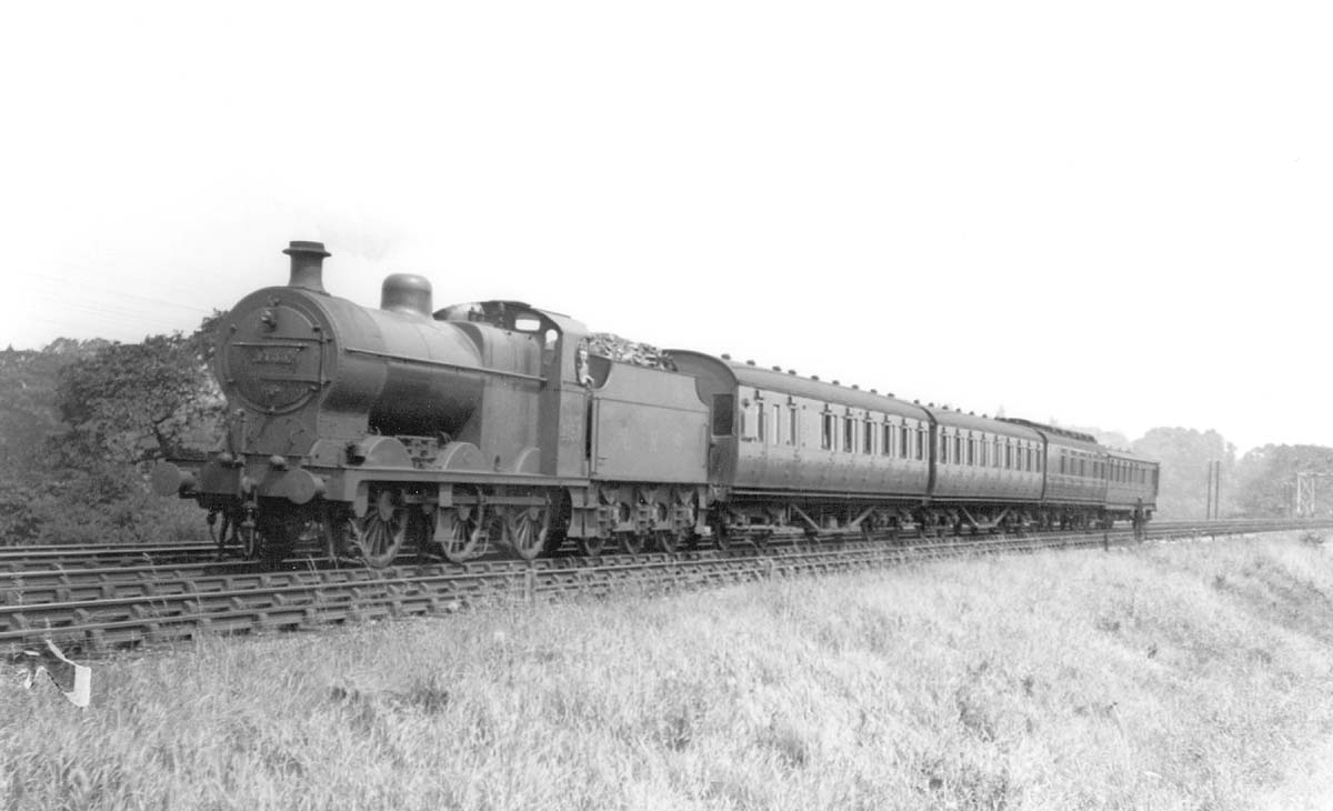 LMS 0-6-0 4F No 4133 is seen having been pressed into service on a local passenger working in the summer of 1936