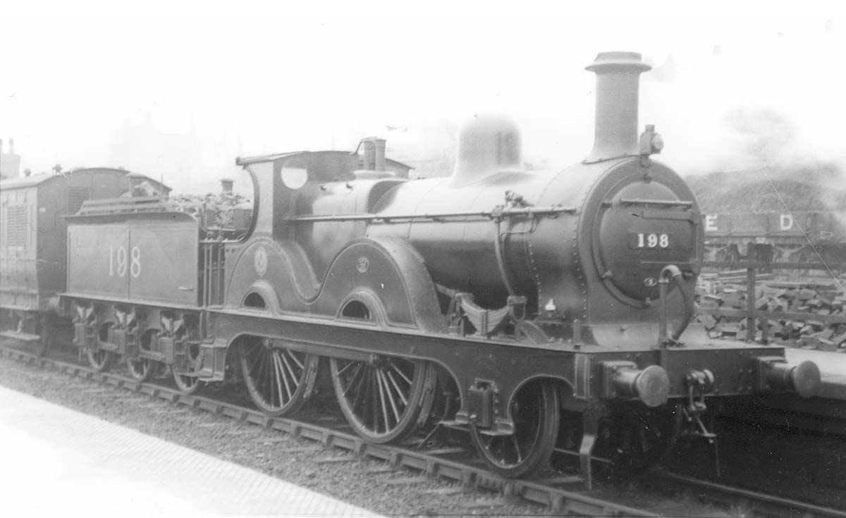 Ex-MR 1P outside-framed 2-4-0 No 198 is seen on a local Evesham passenger train in January 1925