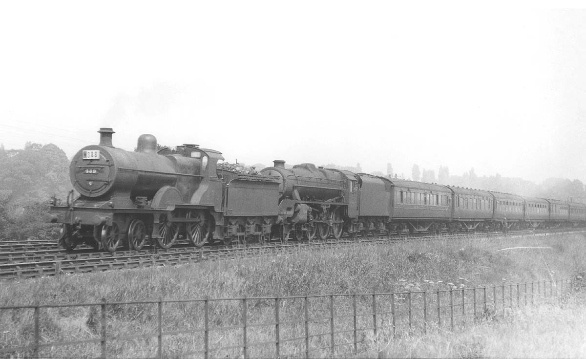 Ex-MR 2P 4-4-0 No 439 doubleheads LMS Stanier 'Black 5' No 5276 on an express south of Kings Norton