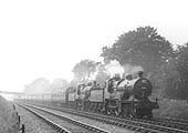 A pair of ex-MR 4-4-0s 483 class locomotives, No 542 and No 402, work an excursion south of Kings Norton in 1937