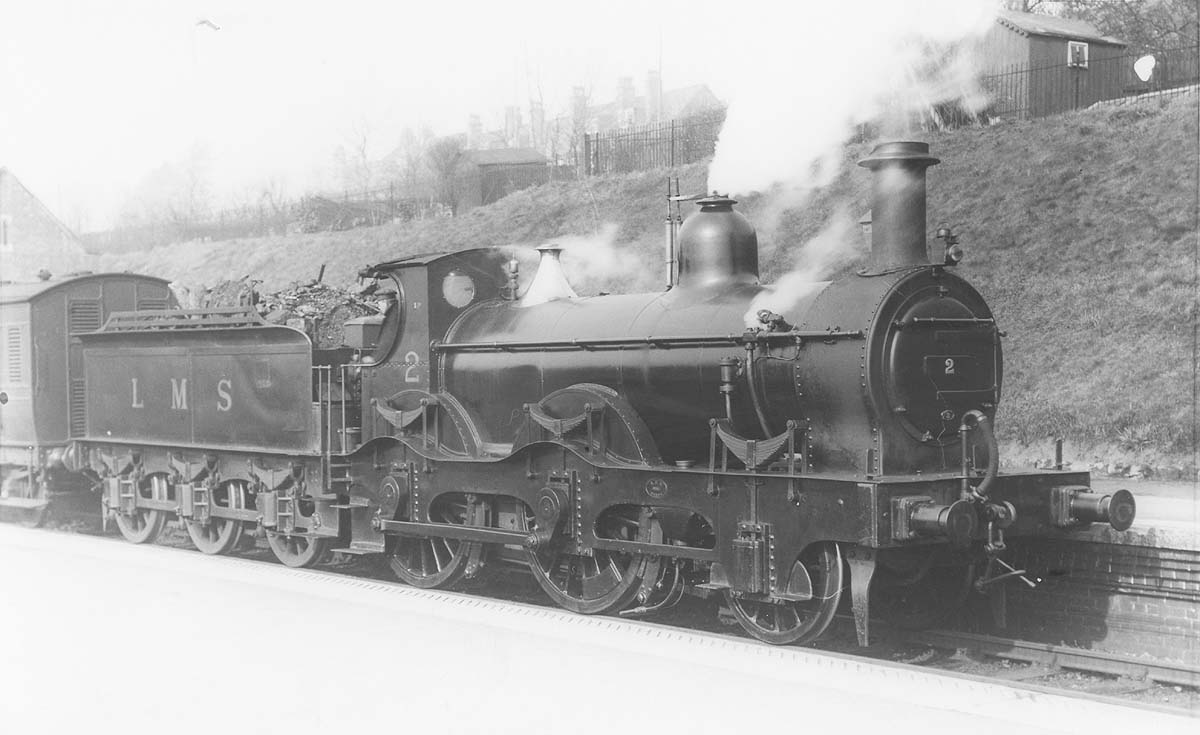 Ex-MR outside curved framed 2-4-0 1P No 2 stands at Kings Norton station on a local Evesham passenger train on 10th March 1932