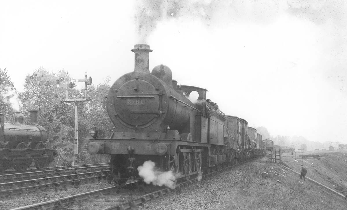 MR 0-6-0 3F No 3181 complete with round top firebox passes MR Kirtley 0-6-0 stopped at the up signals south of Kings Norton station
