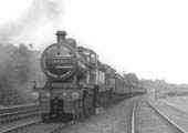 MR 4-4-0 No 524 double heads class mate MR 4-4-0 No 521 on a down express train as it passes the sidings