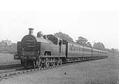 MR 0-6-4T 'Flatiron' No 2036 is seen heading a local passenger train of close coupled carriages circa 1921