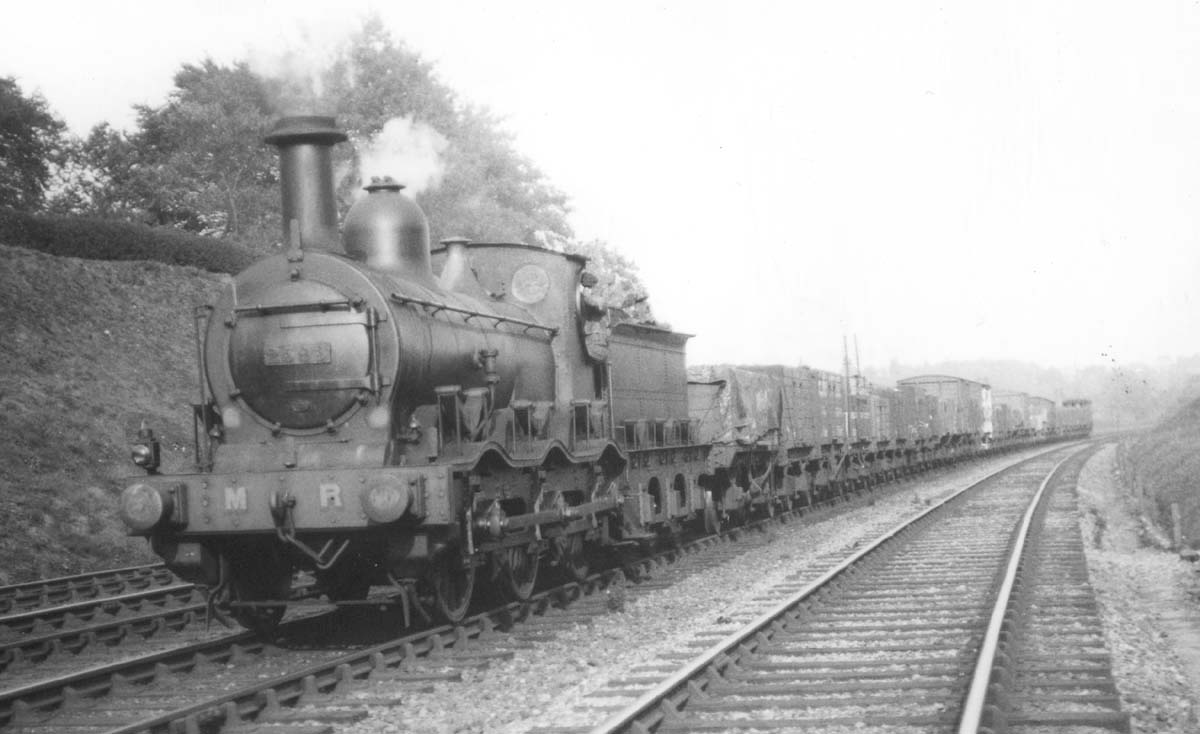 MR 0-6-0 Kirtley No 2593 is seen hurrying along the fast line with a mixed freight train during the early 1920s