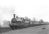 MR Kirtley 1F 0-6-0 No 2678 is seen at the head of a long train of assorted open wagons passing the carriage sidings