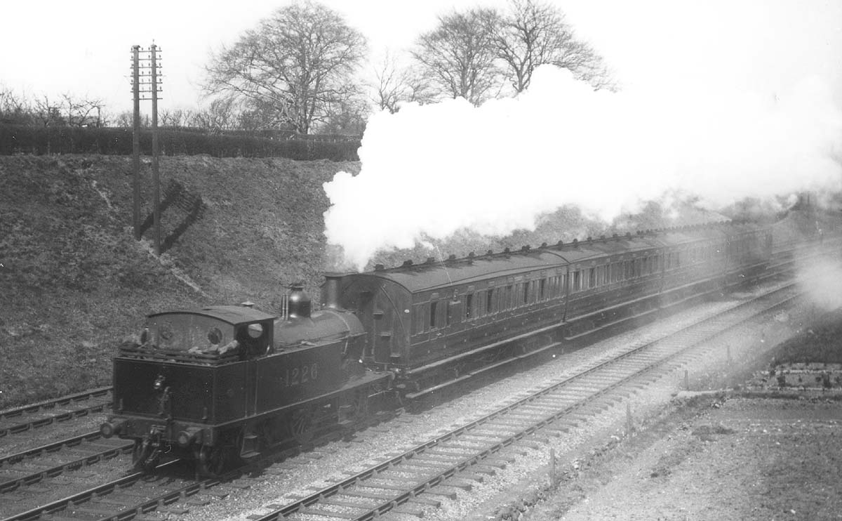 MR 0-4-4T No 1226 is working hard as it runs bunker first on a local passenger train to Northfield