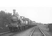 MR 2-4-0 No 279 with several vans behind the tender on a passenger train near Kings Norton