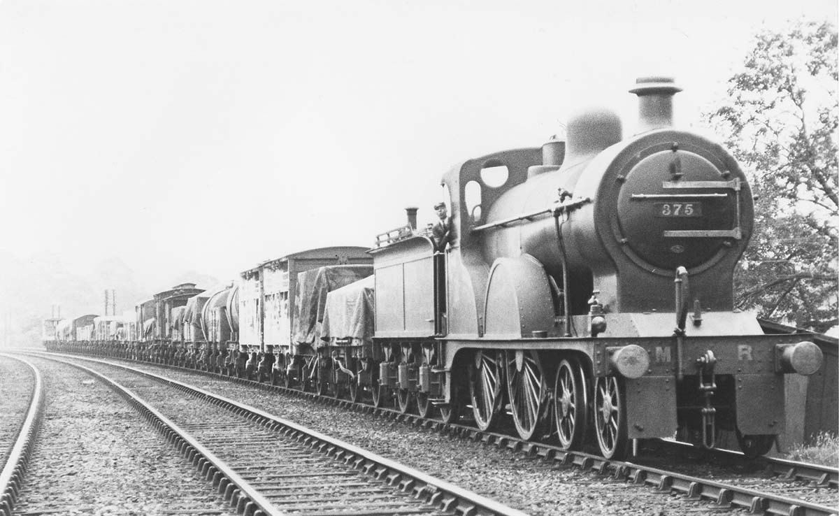 MR 4-4-0 No 375 has been pressed into unusual duties for a 4-4-0 being at the head of a mixed freight train