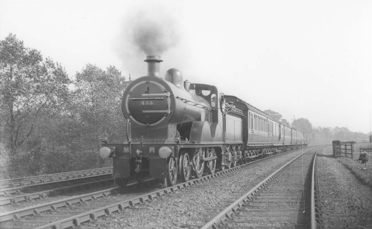 MR 4-4-0 No 435 at the head of a passenger train running on the down fast line near Kings Norton