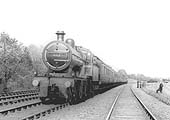 MR 4-4-0 2P No 513 heads a down express service past Kings Norton carriage sidings during 1921