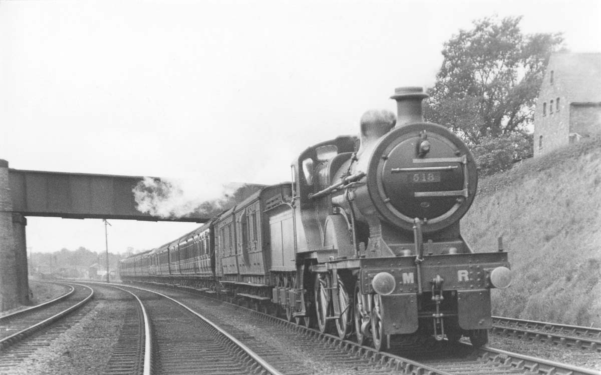 MR 4-4-0 2P No 518 is seen working hard whilst at the head of an express near Kings Norton station in 1921