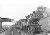 MR 4-4-0 2P No 518 is seen working hard whilst at the head of an express near Kings Norton station in 1921