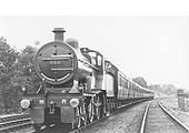 MR 4-4-0 No 523 is seen carrying its No 3 Saltley shed plate whilst on a down express train on 16th July 1921