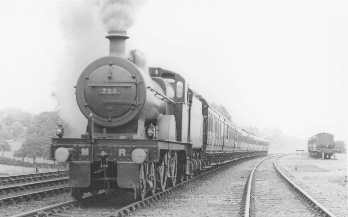 MR 4-4-0 3P No 723 is seen accelerating past Kings Norton carriage sidings whilst at the head of an express train on 16th July 1921