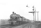 MR 4-4-0 3P No 768 is passing the MR signal gantry south of the carriage sidings whilst at the head of a down express service in March 1922