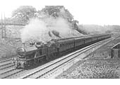 MR 4-4-0 3P No 773 with oil tanks fitted to its tender is seen working hard at the head of a train of clerestory coaches in 1921