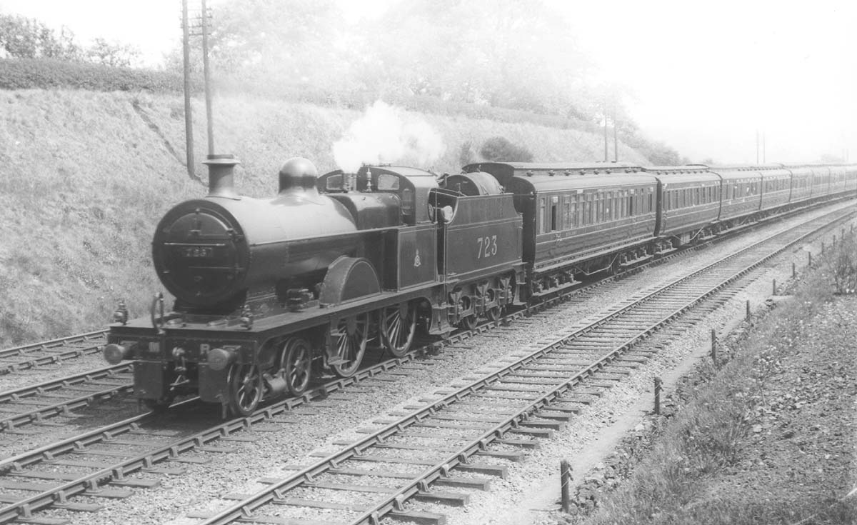 MR 3P 4-4-0 No 723 was also fitted with tanks on its tender for oil firing and is seen with steam escaping from the valves
