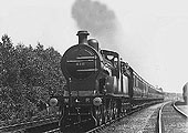 A pre-World War One view of MR  4-4-0 2P No 416 as it has heads an express train south of Kings Norton in 1911