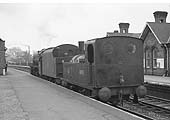 Ex-Midland Railway 0-4-0T '0F' No 41535 is seen being towed through Kings Norton station in the early 1960s