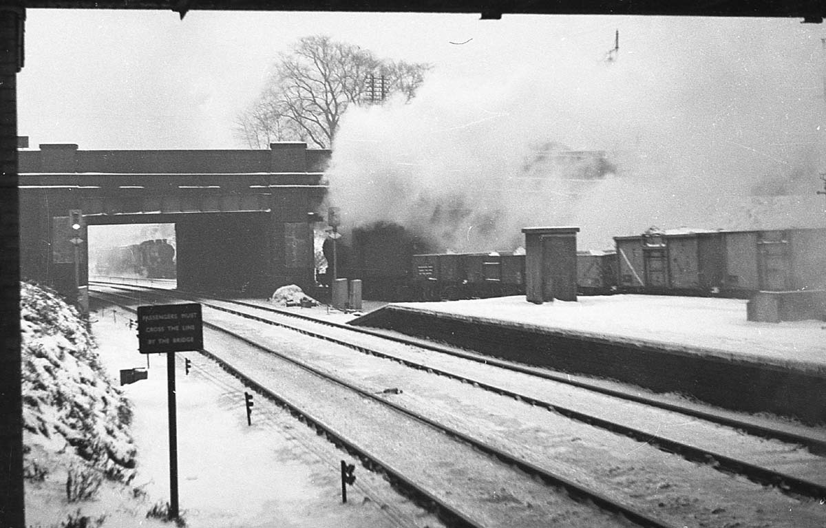 Ex-LMS 0-6-0 4F No 44605 is passing Kings Norton Station with a mineral train for Washwood Heath on a snowy winter's day
