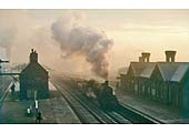 British Railways built 2MT 2-6-0 No 46442 is seen passing through Kings Norton on a down goods service on a cold misty frosty winter's morning