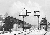 British Railways built Ivatt 2-6-0 4MT No 43047 is seen passing Kings Norton signal box on 10th January 1959