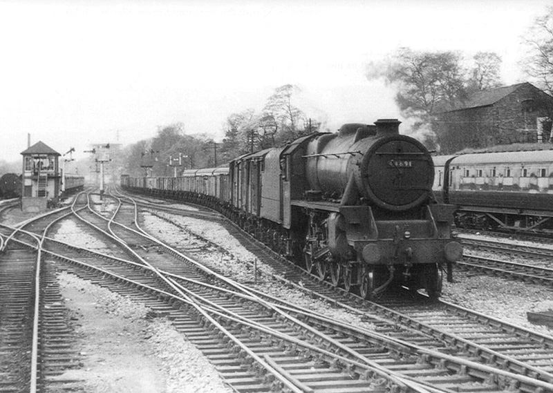 Ex-LMS 4-6-0 Class 5 No 44691 is on a Class E express freight as it crosses from the up main to the up Camp Hill line